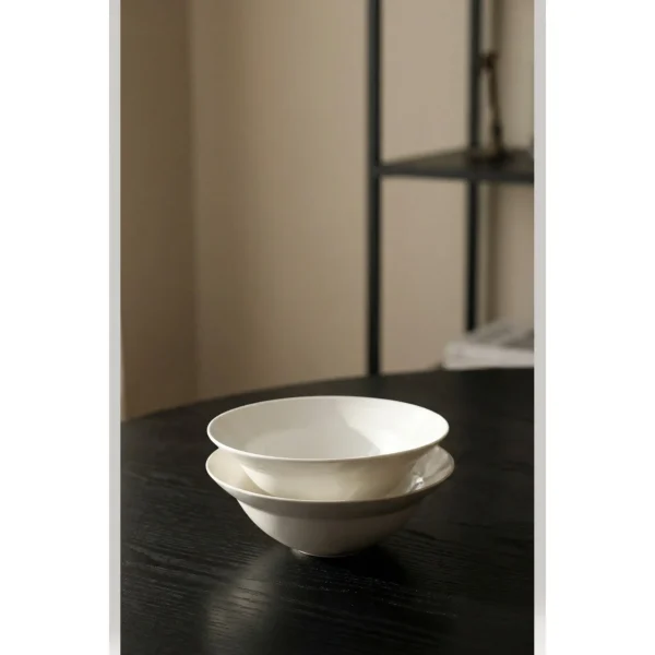 Artist Collaboration Plain White Porcelain Flared Bowls in ivory — in a room setting