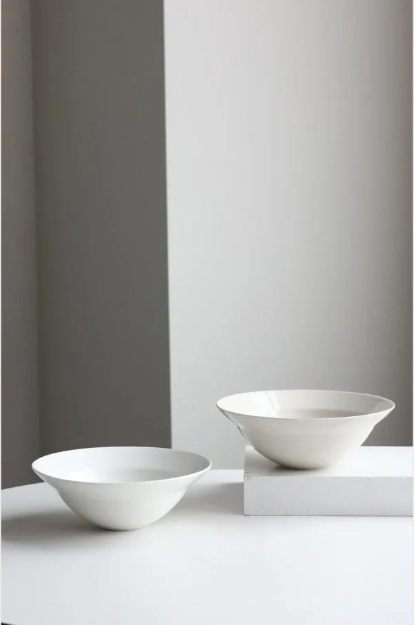 Artist Collaboration Plain White Porcelain Flared Bowls in ivory — in a room setting