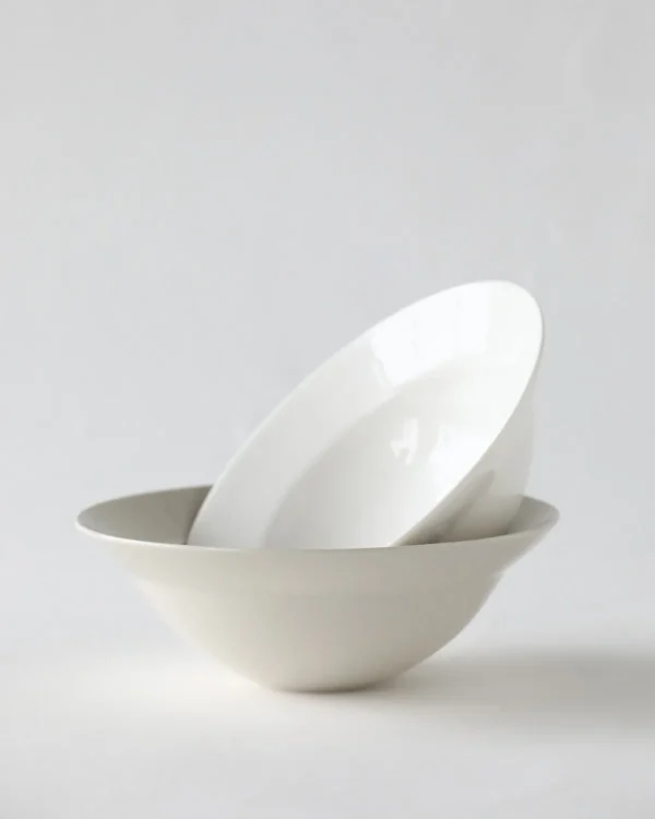 Artist Collaboration Plain White Porcelain Flared Bowls in ivory — in a room setting
