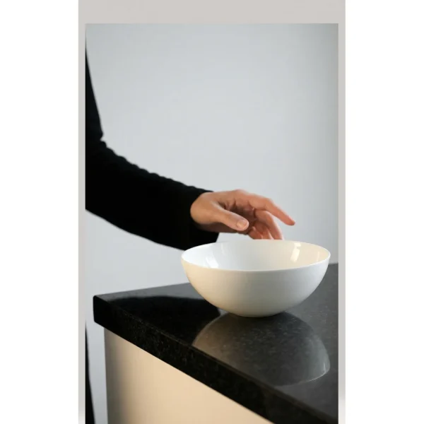 Artist Collaboration Pure White Ceramic Conical Bowl in ivory — in a room setting
