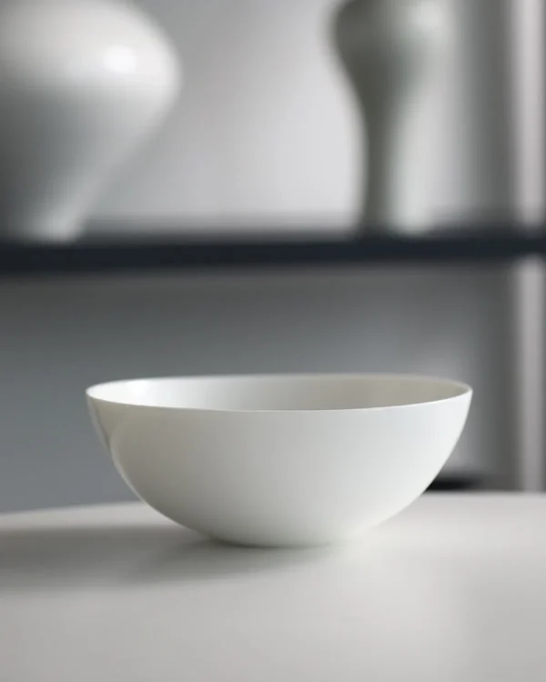 Artist Collaboration Pure White Ceramic Conical Bowl in ivory — in a room setting