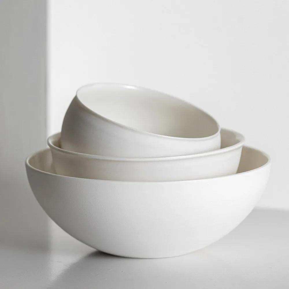 Artist Collaboration Soft-Glow White Porcelain Bowls and Cup in ivory — front view
