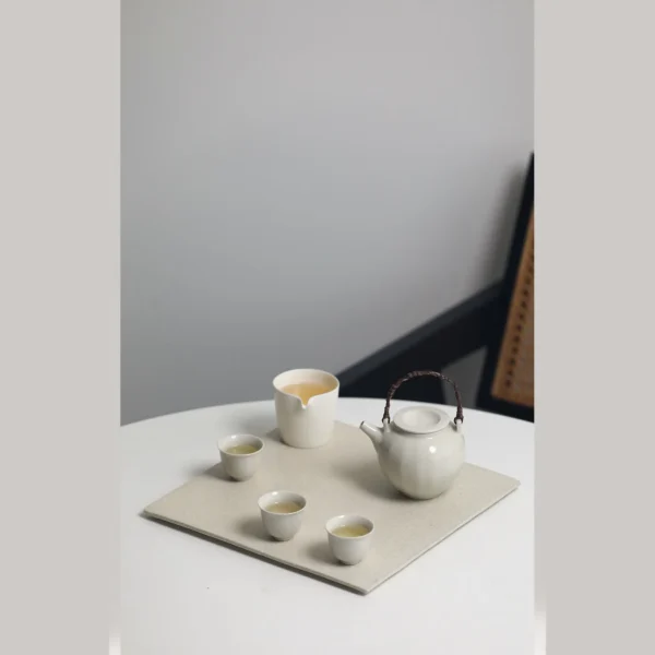 Artist Collaboration Square Stoneware Tea Tray, Small or in sand — in a room setting