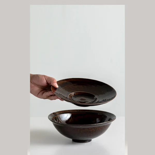 Artist Collaboration Soy-Brown Glaze Conical Bowl and in clay — in a room setting