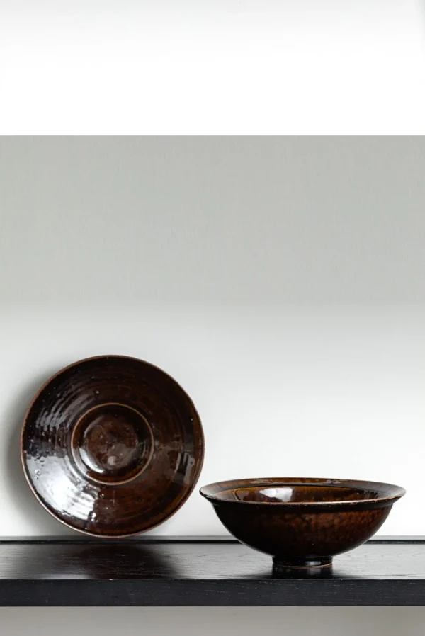 Artist Collaboration Soy-Brown Glaze Conical Bowl and in clay — in a room setting