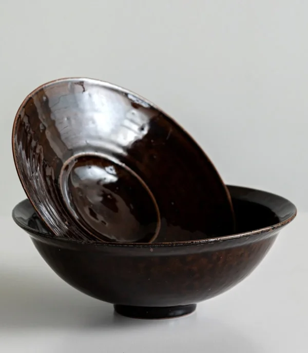 Artist Collaboration Soy-Brown Glaze Conical Bowl and in clay — in a room setting