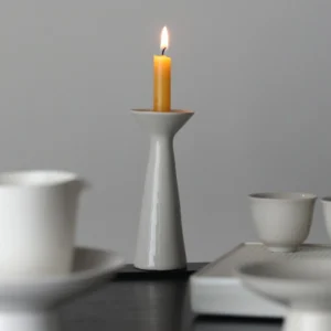 Artist Collaboration White Ceramic Candle Holder, Tapered in ivory — front view