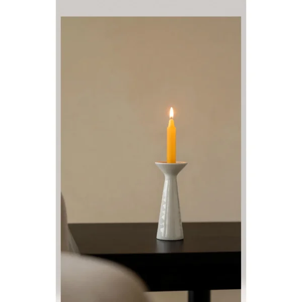 Artist Collaboration White Ceramic Candle Holder, Tapered in ivory — in a room setting