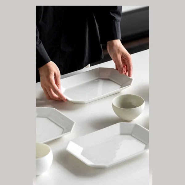 Artist-Collaboration White Porcelain Octagonal Plates in ivory — in a room setting