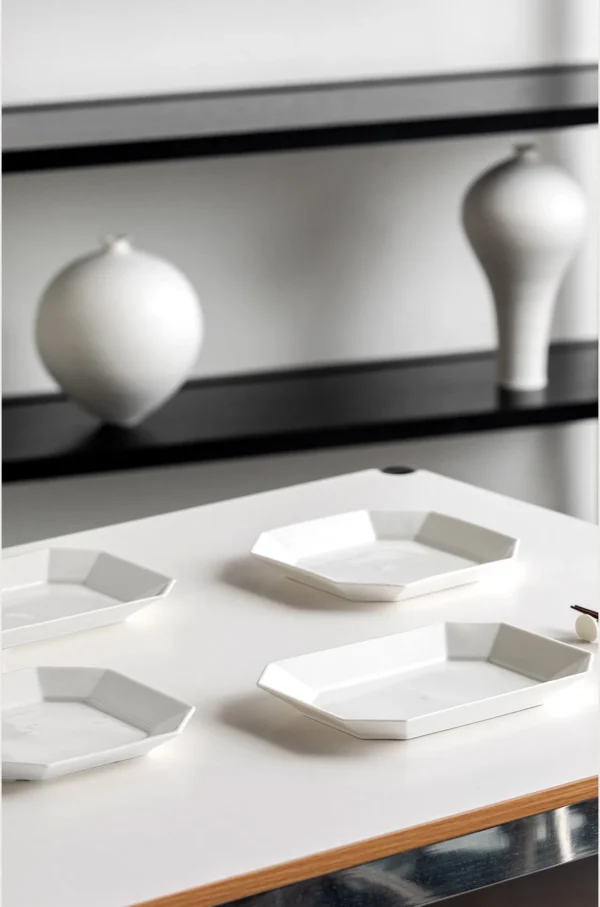 Artist-Collaboration White Porcelain Octagonal Plates in ivory — in a room setting