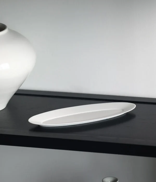 Artist Collaboration White Porcelain Leaf Boat Plate in ivory — in a room setting