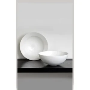 Artist Collaboration White Porcelain Wide Soup Bowls in ivory — in a room setting
