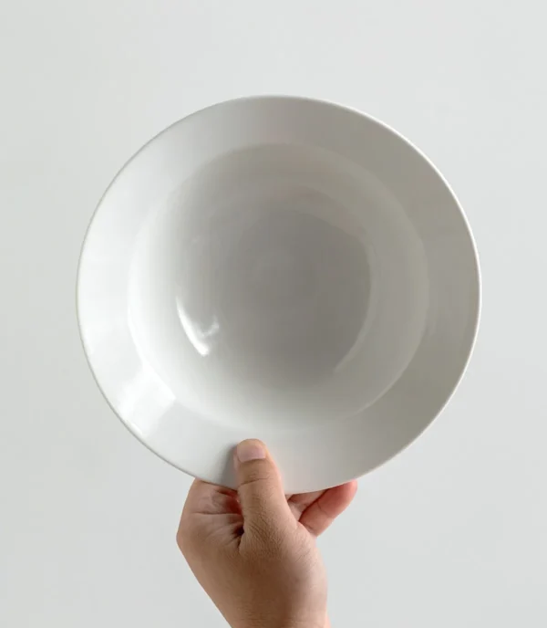 Artist Collaboration White Porcelain Wide Soup Bowls in ivory — in a room setting