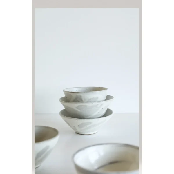 Artist Collaboration White Swirl Stoneware Conical Bowls in ivory — in a room setting