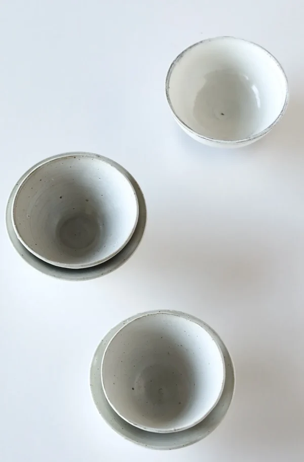 Artist Collaboration White Swirl Stoneware Conical Bowls in ivory — in a room setting