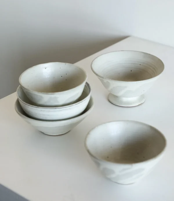Artist Collaboration White Swirl Stoneware Conical Bowls in ivory — in a room setting