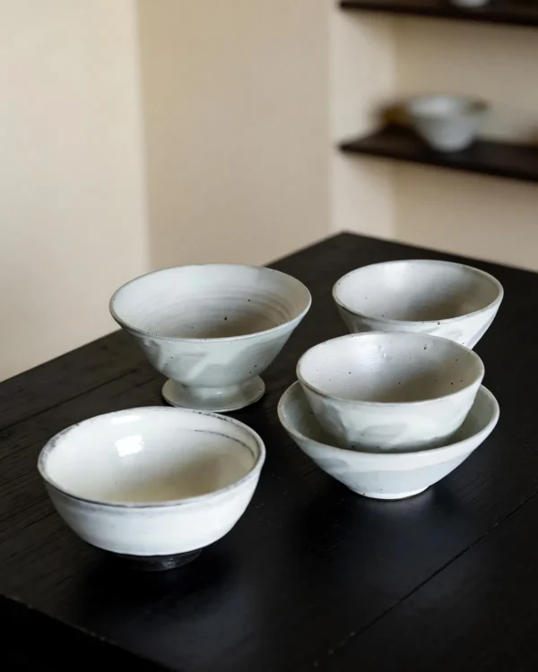 Artist Collaboration White Swirl Stoneware Conical Bowls in ivory — in a room setting