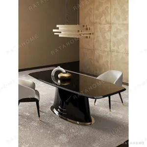Yujing High-Gloss Ebony Dining Table with Champagne Trim in clay — in a room setting