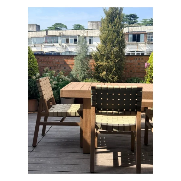 Teak Outdoor Dining Table with Bench and Webbed Chairs in natural oak — in a room setting
