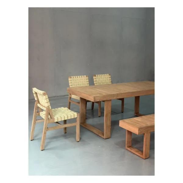 Teak Outdoor Dining Table with Bench and Webbed Chairs in natural oak — in a room setting