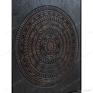 Hena Teak Small Side Cabinet with Carved Mandala Door, 60 cm in black — in a room setting