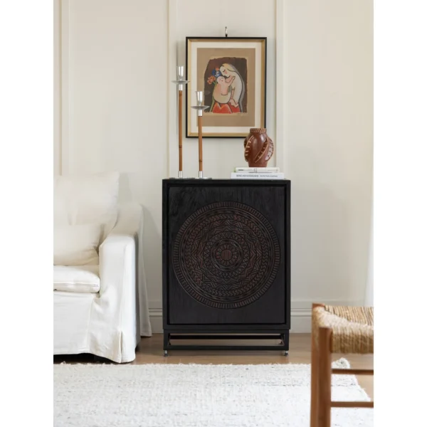 Hena Teak Small Side Cabinet with Carved Mandala Door, 60 cm in black — in a room setting