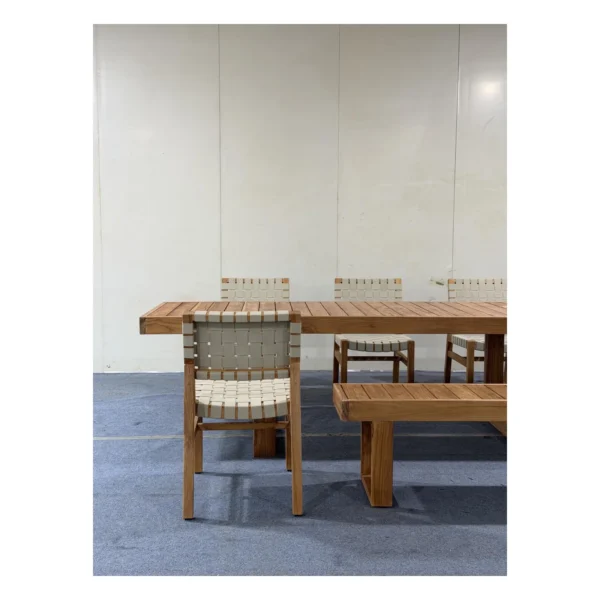 Teak Outdoor Dining Set with Webbed Chairs and Bench in natural oak — in a room setting