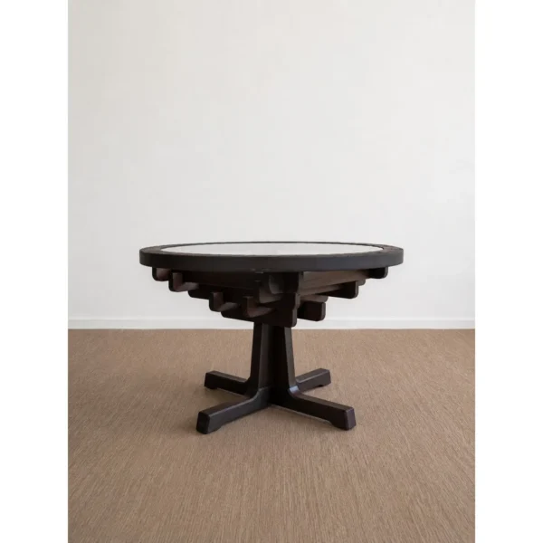 Tenon Nexus Round Glass-Top Table on Joined Wood Base in clay — in a room setting