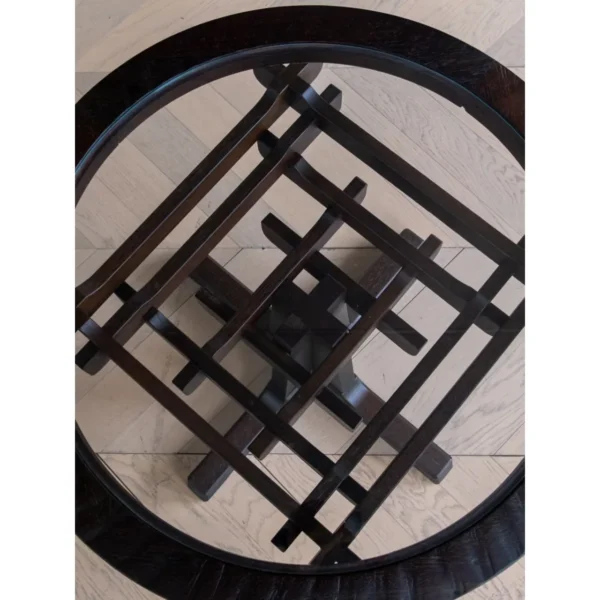 Tenon Nexus Round Glass-Top Table on Joined Wood Base in clay — in a room setting