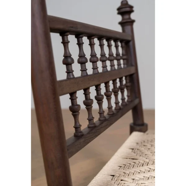 Terra Low Carved Wood Chair with Woven Seat in clay — in a room setting