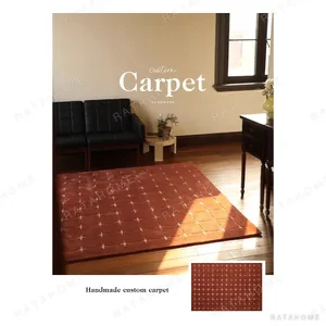 Terracotta Grid Rug with Cream Cross Dots in rust — in a room setting