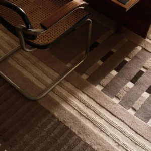 Terracotta Low Saturation Geometric Textured Rug in rust — in a room setting