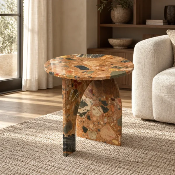 Warm Terrazzo Marble Side Table on Sculpted Slab Base in clay — in a room setting