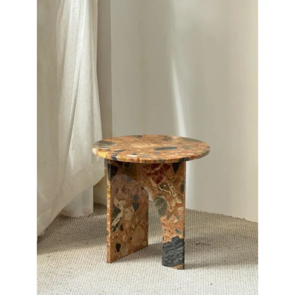 Warm Terrazzo Marble Side Table on Sculpted Slab Base in clay — in a room setting