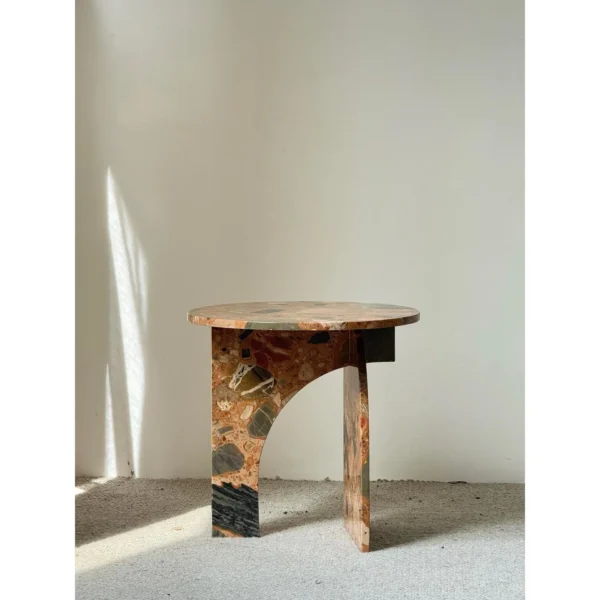 Warm Terrazzo Marble Side Table on Sculpted Slab Base in clay — in a room setting