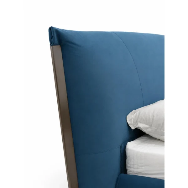 Deep Blue Upholstered Bed with Dark Trim in blue — in a room setting