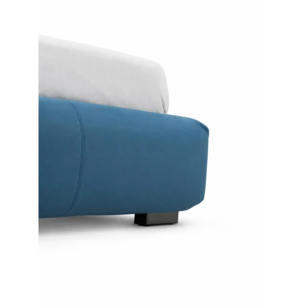 Deep Blue Upholstered Bed with Dark Trim in blue — in a room setting