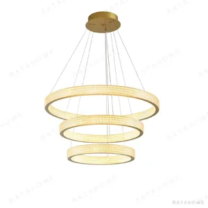 Textured Gold Single Ring Pendant Light, 50 or 75 cm in brushed brass — in a room setting