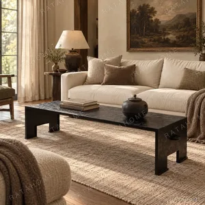 U-Form Textured Black Coffee Table with Half-Round Ends in black — in a room setting