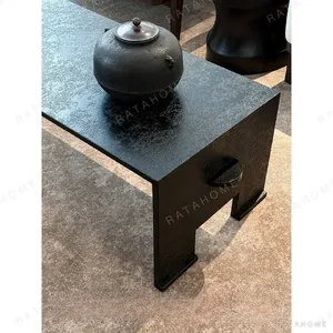 U-Form Textured Black Coffee Table with Half-Round Ends in black — in a room setting