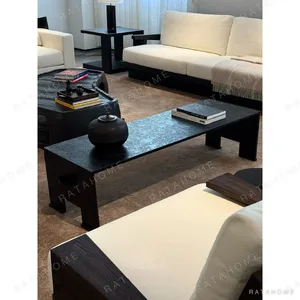 U-Form Textured Black Coffee Table with Half-Round Ends in black — in a room setting