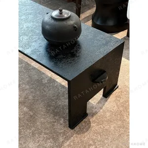 U-Form Textured Black Coffee Table with Half-Round Ends in black — in a room setting