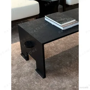 U-Form Textured Black Coffee Table with Half-Round Ends in black — in a room setting