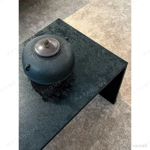 U-Form Textured Black Coffee Table with Half-Round Ends in black — in a room setting