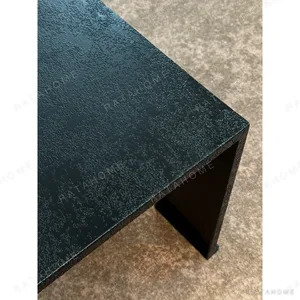 U-Form Textured Black Coffee Table with Half-Round Ends in black — in a room setting