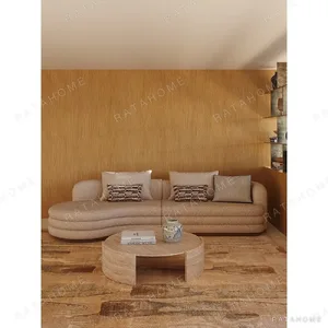 Thick-Cut Sandwich Curved Sofa in sand — in a room setting