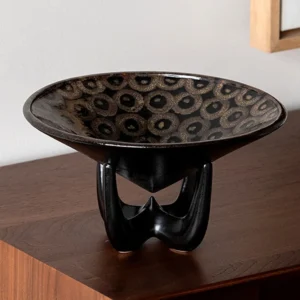 Three-Legged Black Ceramic Art Fruit Plate with Ring Pattern in black — front view