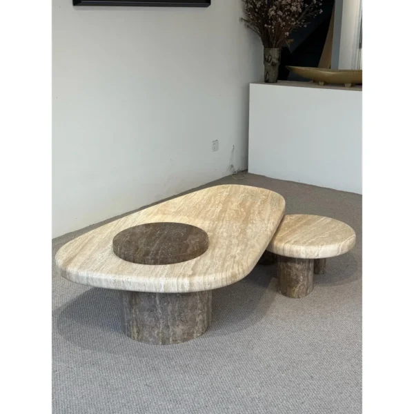 Travertine Nesting Coffee Table Pair on Cylinder Legs in sand — in a room setting