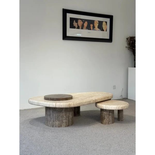 Travertine Nesting Coffee Table Pair on Cylinder Legs in sand — in a room setting