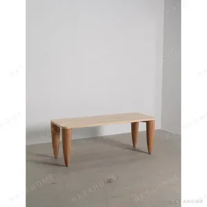 Travertine-Top Elephant-Leg Table in Ash — in a room setting